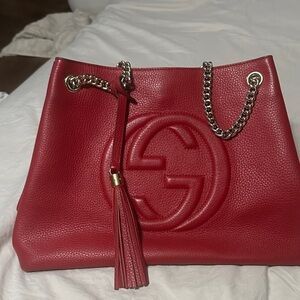 Pre owned Gucci Red Shoulder Bag with GoldHardware and Tassel Accents.